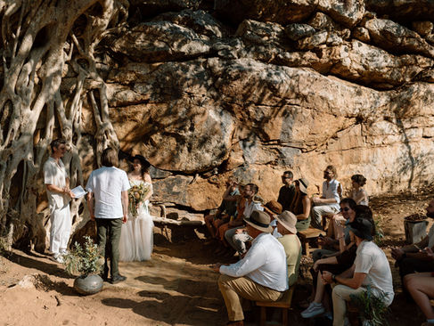 Safari wedding guests seated waiting for ceremony to begin