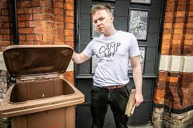 With Love, Mr Gay advertisement poster showing a man holding the lid of a brown bin open