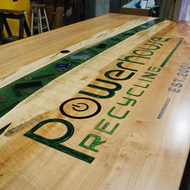 large-conference-river-table-with-cnc-logo-embedded-electronics-custom-wood-furniture.jpg