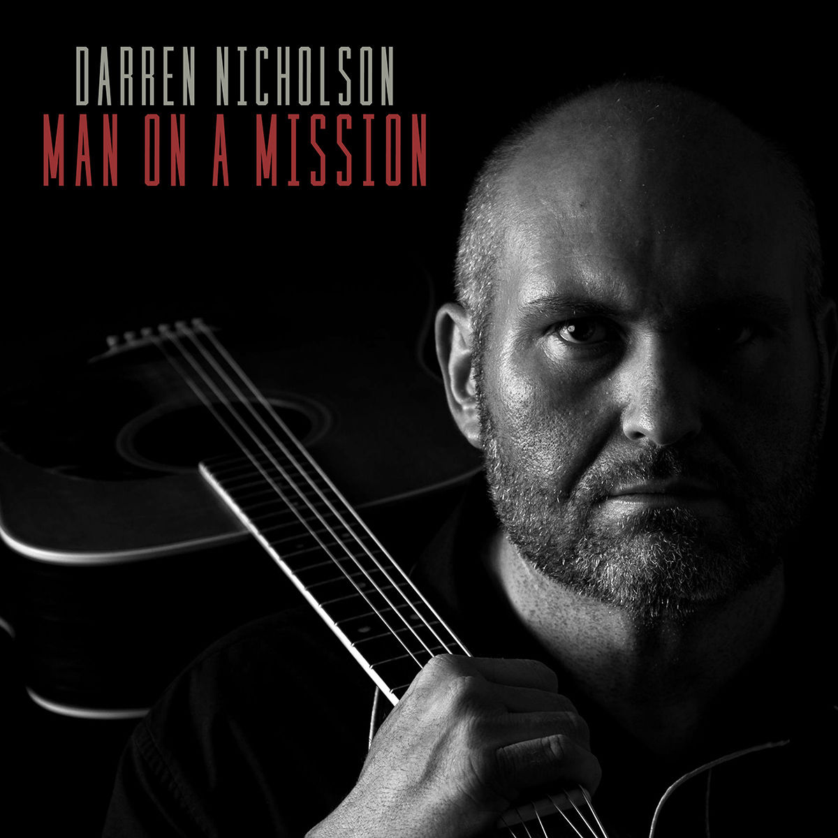 Darren Nicholson, Man on a Mission album cover with guitar in black and white