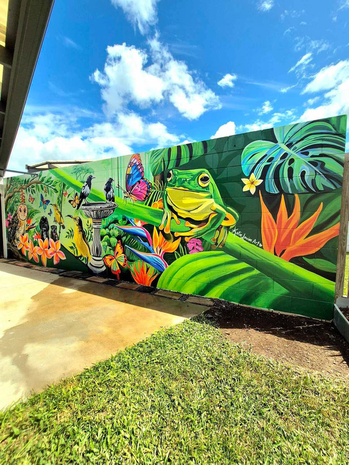 Keywords: Tropical backyard mural, outdoor wall art, custom mural artist, vibrant rainforest mural, backyard wall transformation, Australian native birds mural, tree frog mural art, bespoke mural design, tropical garden mural, outdoor mural artist Townsville.
	•	Meta Description: Transform your backyard into a tropical paradise with custom mural art. This stunning outdoor wall mural features a vibrant green tree frog, colorful butterflies, and native Australian birds, perfect for adding life and beauty to your space.
	•	Title: Vibrant Tropical Backyard Wall Mural - Custom Outdoor Art by Katie Louise