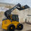 Thumbnail: skid steer loader side view with bucket raised