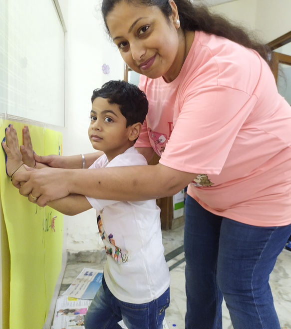 a child with autism doing fun activity with her mother