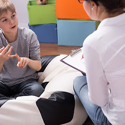 a speech therapy teaching a child to speak