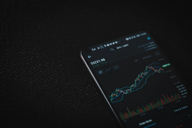Professional trader studying market charts in a modern trading office for quick trading education