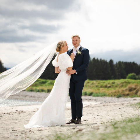 Bride and groom on beach