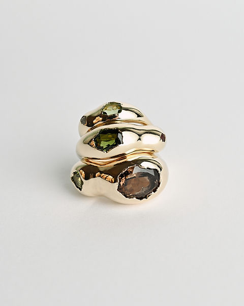 Three minimalist gold rings with irregular organic design with gemstones by Maria Kobelova