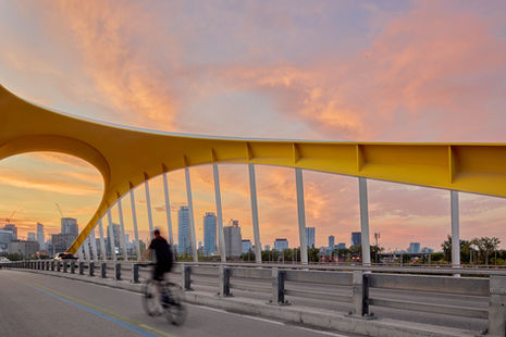 Yellow Cherry Street Bridge crossing the Don River in Toronto at sunset