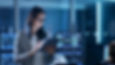 Young Female Government Employee Wearing Glasses Uses Tablet in System Control Center. In