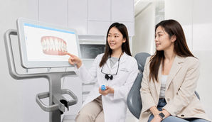 Cosmetic dentistry consultation with a prosthodontist at Longwood Dental in Taipei discussing smile design and aesthetic dental treatment with a patient.