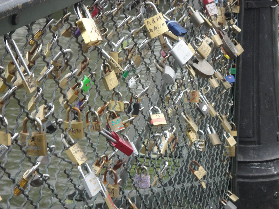 Couples write their names on a lock, attach it to a fence on a bridge & throw the key into the Seine River to symbolize their eternal love.