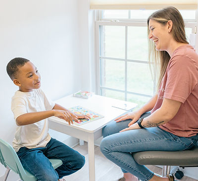 Child and clinician working together in therapy