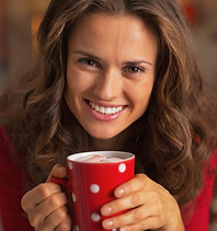 Smiling young woman in christmas red dre