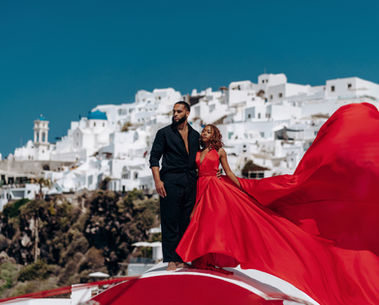 Romantic Santorini photoshoot for couples with white cave houses views