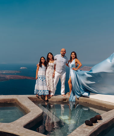 Family vacation photography in Santorini with caldera views
