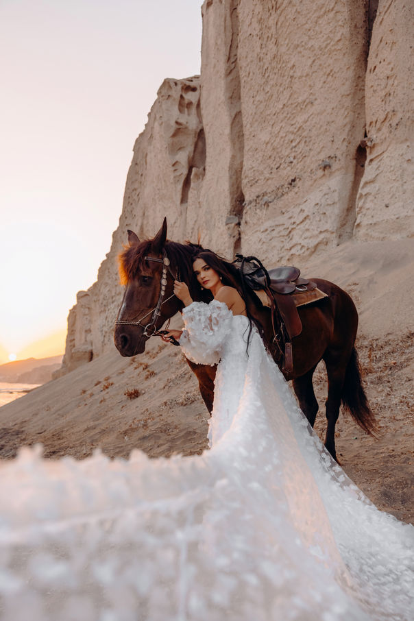 Santorini flying dress photoshoot with horse luxury experience on the beach