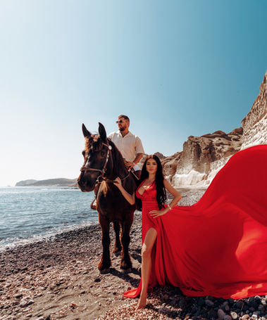 Luxury Santorini photography with horse and ocean backdrop