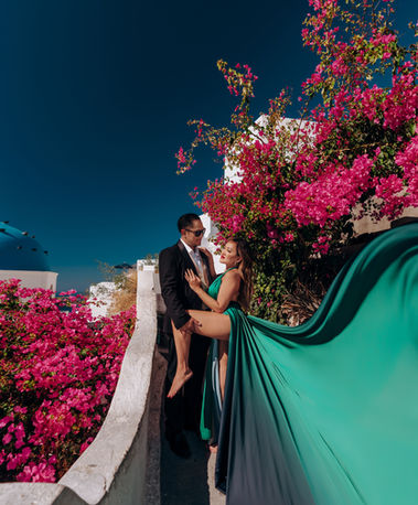 Luxury couple flying dress session in Imerovigli