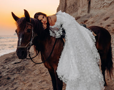 Santorini sunset horse riding photography with cinematic scenery