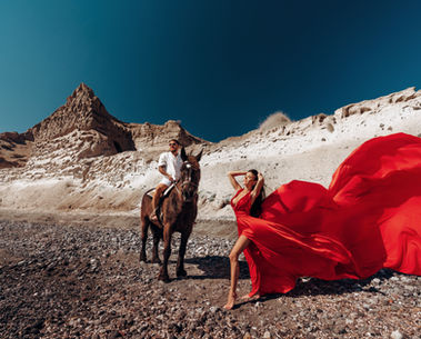 Elegant Santorini couple portrait with flying dress