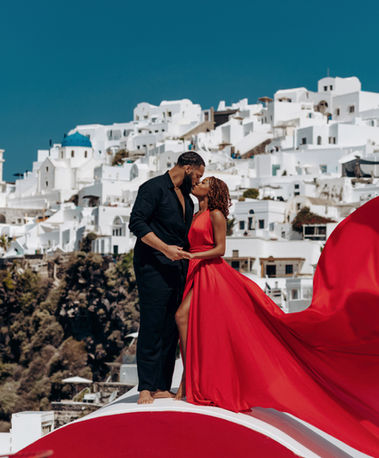 Luxury couple flying dress session in Imerovigli Santorini