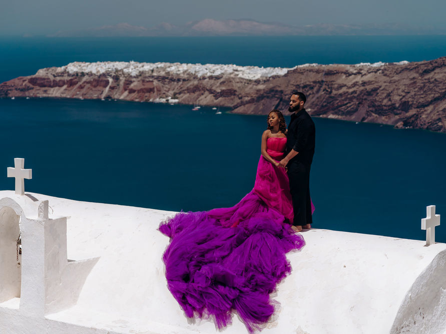 flying dress photoshoot imerovigli caldera volcano view
