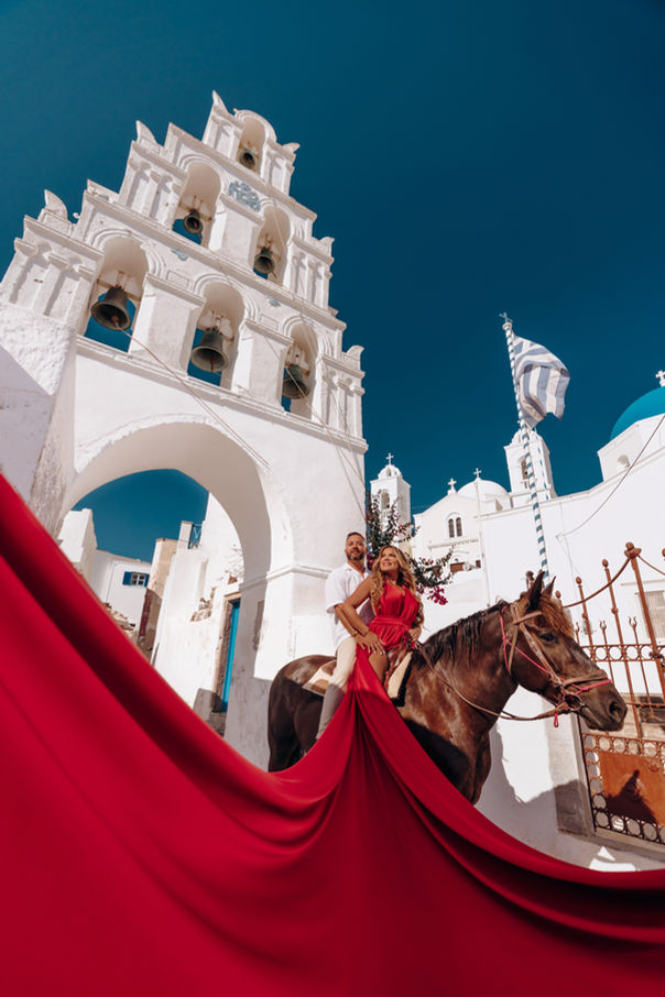 Editorial fashion shoot Santorini flying dress with horse