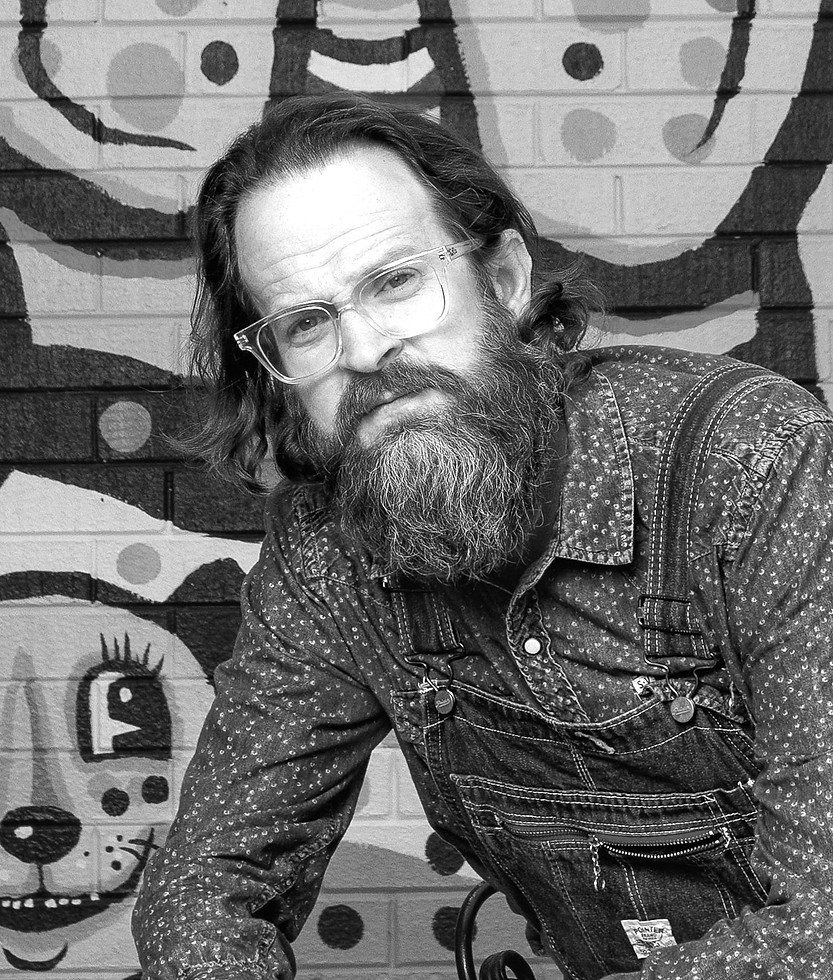 Kyle-BlackCatTips-Brooks-portrait-with-highpoint-hound-mural_edited.jpg