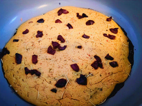 High-protein vegan socca flatbread made with chickpea flour and olives, baked in a skillet with golden edges