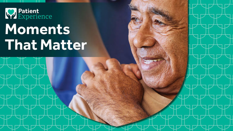 Older person holding the hand of a provider.