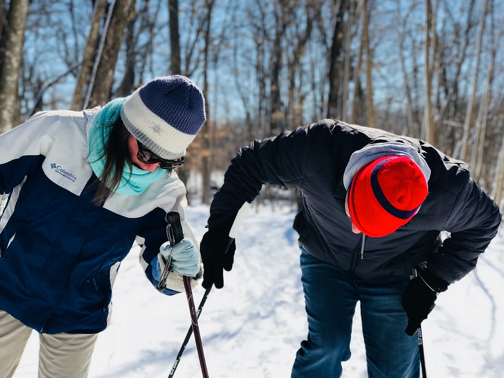 Puzzled cross-country skiers are trying to figure stuff out.