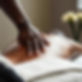 a photo of a black therapist hand massaging a back.jpg