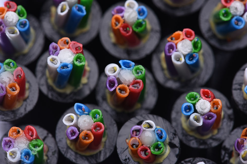 Close-up of underground fiber optic cables in conduit trench, representing high-speed network infrastructure and connectivity.