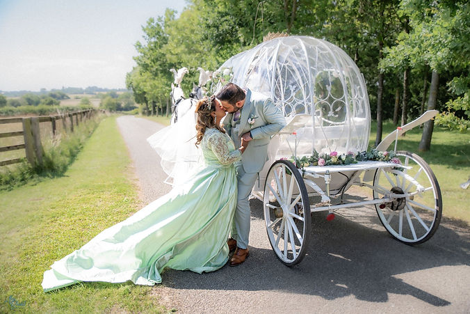 Suffolk Wedding with cinderella coach and horses.jpg