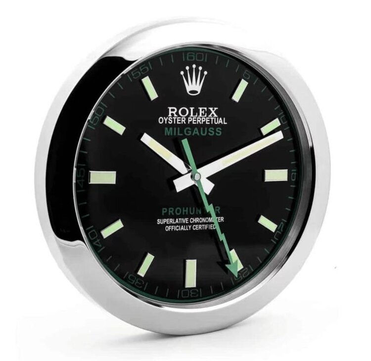 Rolex Milgauss green dial wall clock angled view showing silver case and luminous green markers