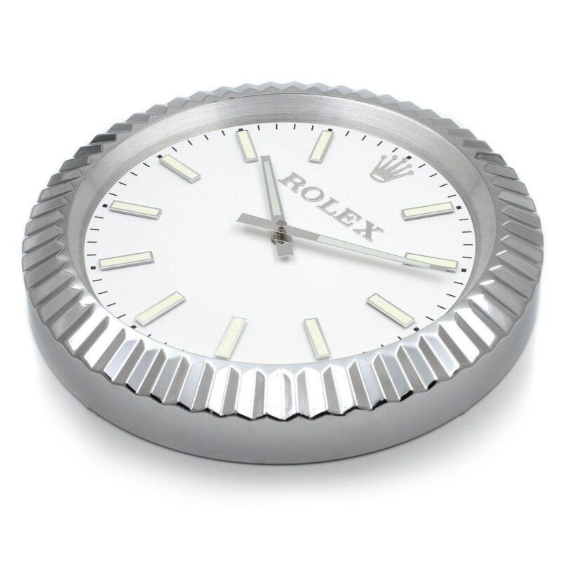 Side profile of stainless steel silver wall clock showing fluted bezel detail
