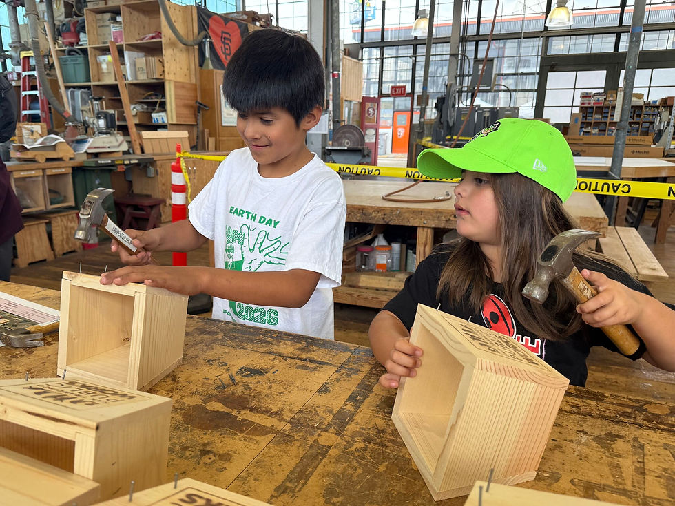 Kids work on planter boxes during Public Works' open house at its Operations Yard.