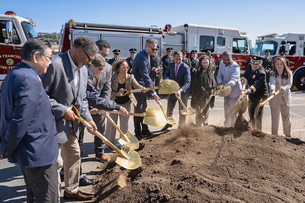 A group of City officials holding golden shovels and turning some dirt in a large pile. They at a groundbreaking ceremony.