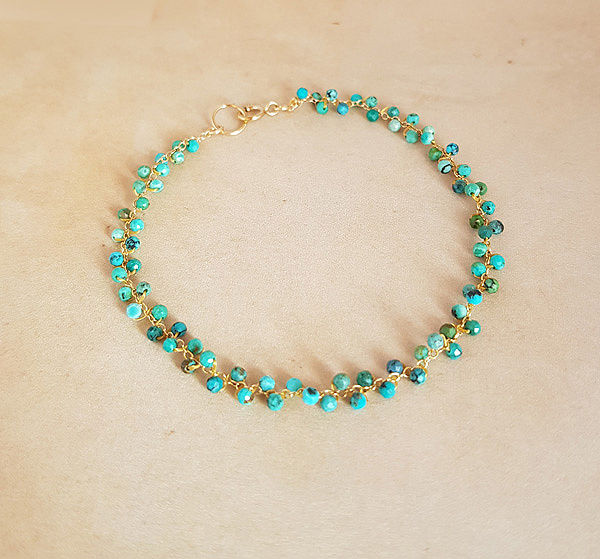 Handgemaakte armband Haylee goud geweven turquoise