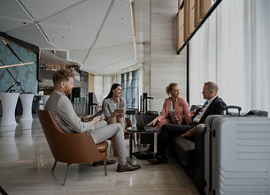 A professional business meeting in a modern office setting, illustrating Gifits' commitment to client engagement and strategic discussions. This image highlights the importance of personalized solutions and partnership in achieving business transformation.