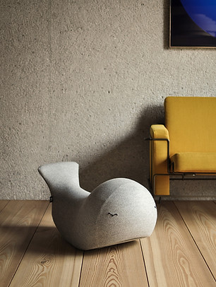 grey rocking whale and play furniture in front of sofa in the living room