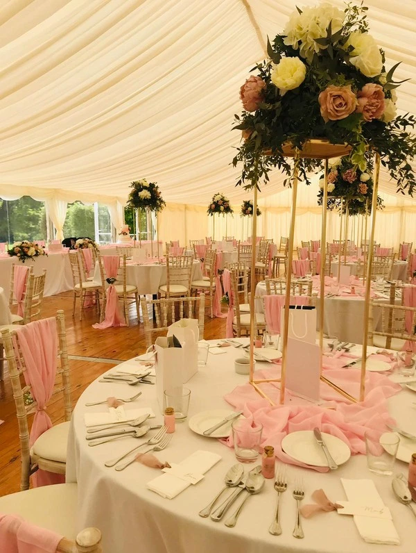 wedding table with floral centrepiece and table settings