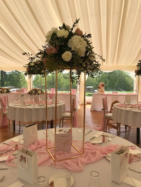 wedding table with floral centrepiece and table settings