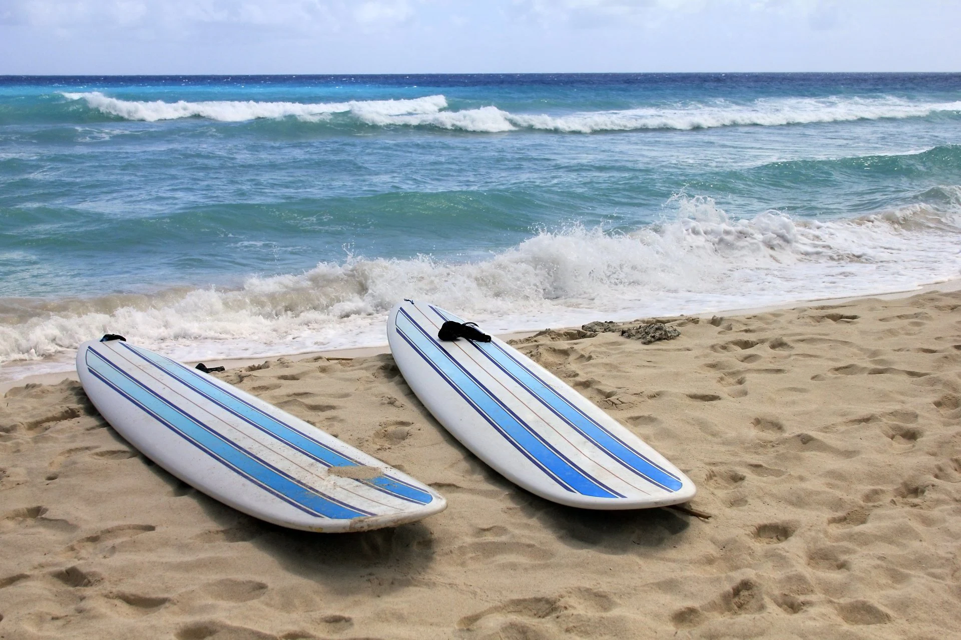 surfing-in-the-caribbean-dover-beach-barbados.webp
