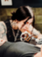 Kerrie, Female tattoo artist in Milton Keynes working on a client.