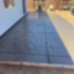 Landscaping contractor installing stamped concrete patio