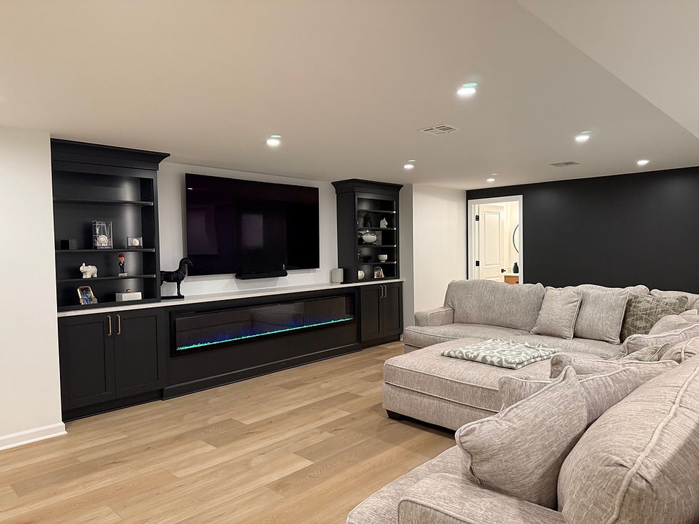 Modern basement home renovations with built-in media center.