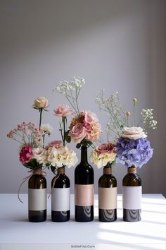 empty wine bottles filled with flowers