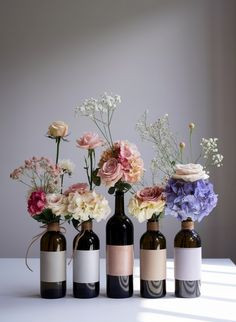 empty wine bottles filled with flowers