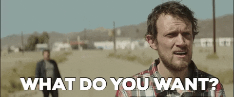 light-skinned man screaming in the middle of a desert town screaming "what do you want?"